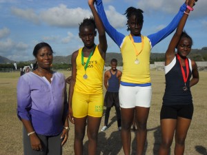 Minister Pierre with winners of the 100m sub-junior girls' race