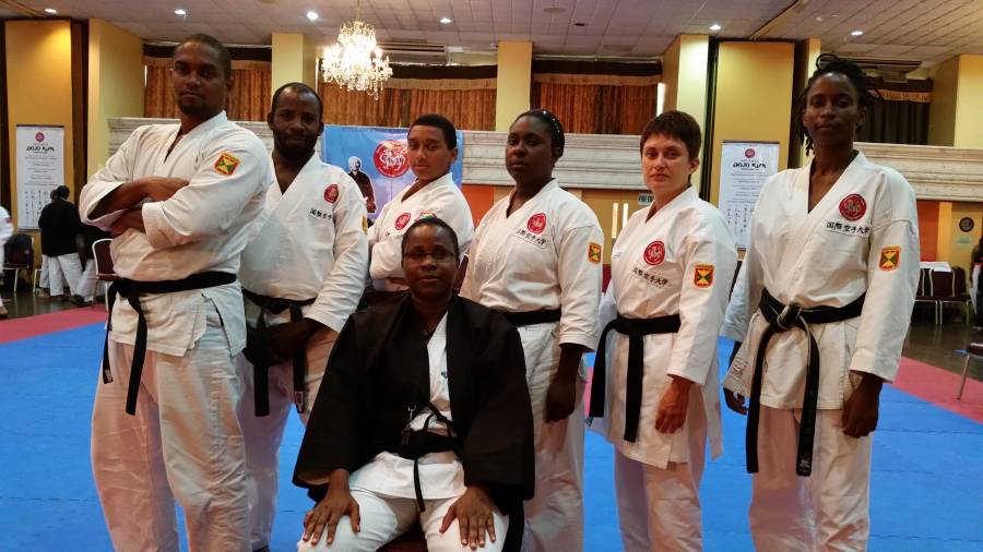 Sensei Joseph flanked by team members, (L–R) Tisagh Chase, Byron George, Christian Chow Chung, Racquel Ratoo, Anya Chow Chung and Adanna Moore