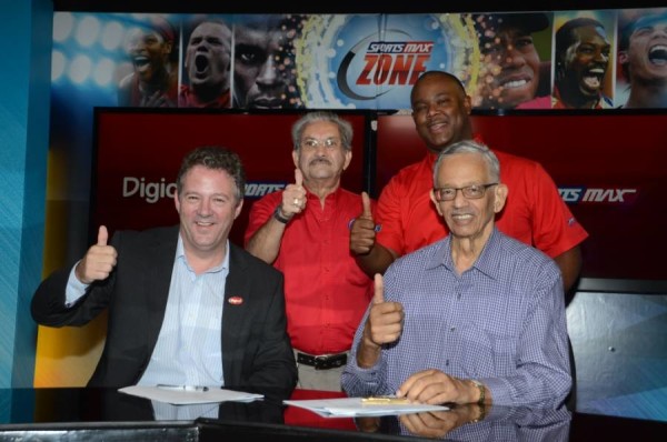 Digicel Group COO, Andy Thorburn, and Patrick Rousseau, Chairman of IMC and SportsMax (front row left and right) celebrate with Phillip Martin, Deputy Chairman of IMC and Sportsmax (standing left) and Oliver McIntosh, CEO of Sportsmax (standing right).