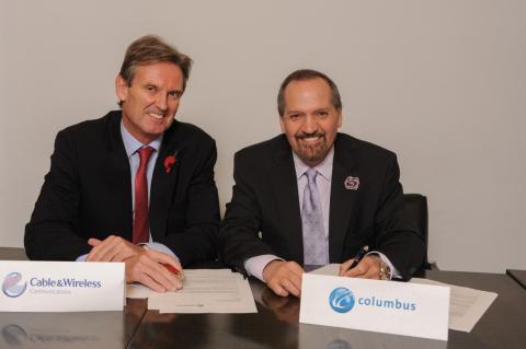 Stronger, faster, smarter: Phil Bentley, Chief Executive Officer of Cable and Wireless  Communications (left) and Brendan Paddick, CEO and Chairman of Columbus Communications are all smiles after inking the proposed merger agreement between both companies earlier today in London.