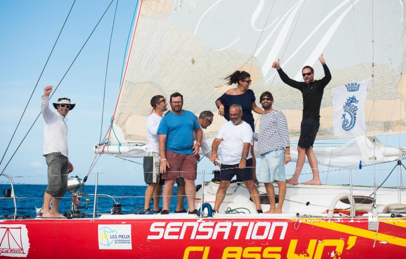 A jubilant crew on Sensation Class 40 celebrate their arrival - RORC/Arthur Daniel & Orlando K Romain