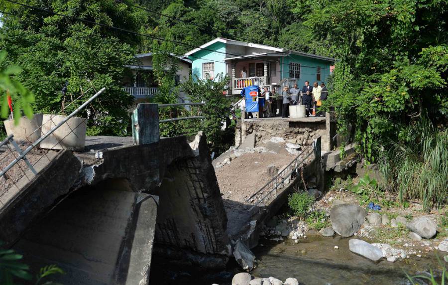 British Prime Minister David Cameron visits a damaged bridge in Grenada which has only just recently collapsed entirely.