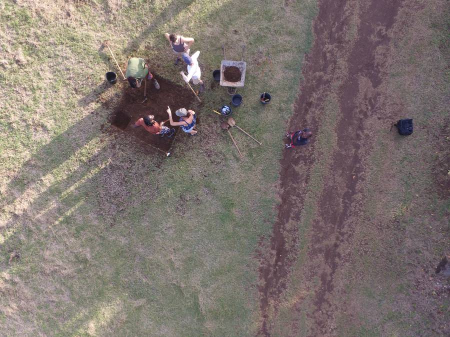 Aerial view of a test pit being excavated at La Poterie