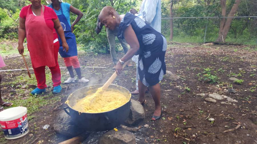 Senator Brenda Hood stirring cou cou at Saraka preparations