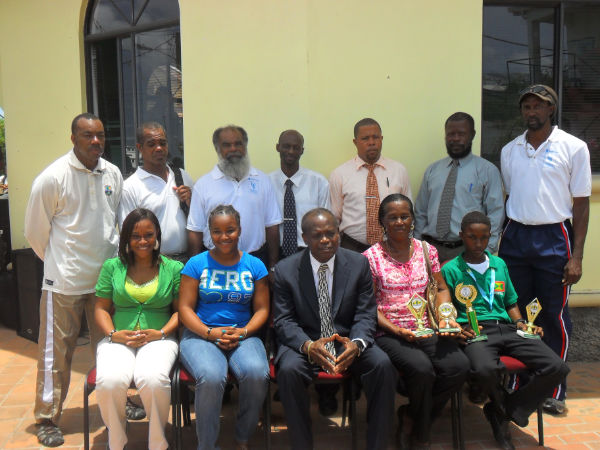 Emmanuel Stewart with his family, Minister for Carriacou and PM Affairs Hon. Nimrod, Ministry Officials and Cricket Officials