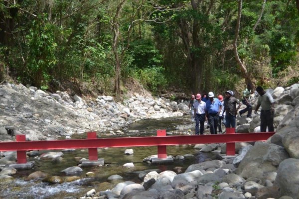 A restraint in place to hold back fallen trees, etc during heavy rains.