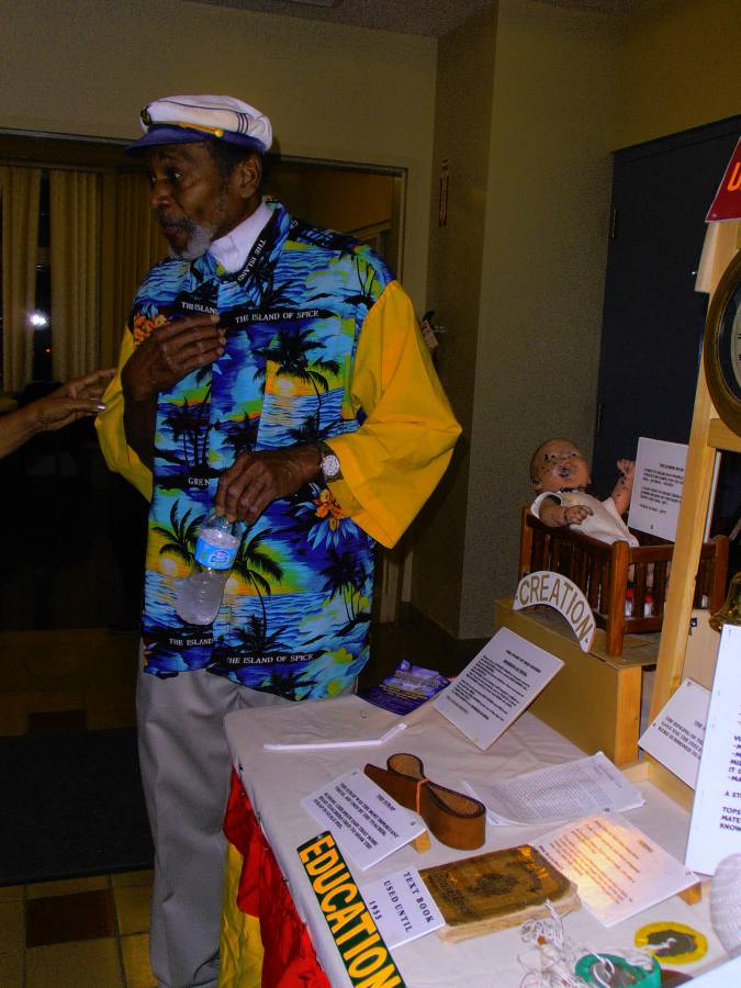 Dudley Hood showcasing his mobile museum that shows a Royal Reader on the table